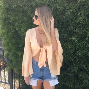 Orange tie crop top from 12th Tribe